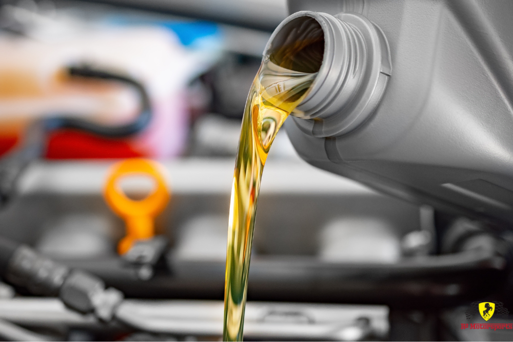 Fresh motor oil being poured into a car engine during an oil changes in Castaic, CA at R2 Motorsports.