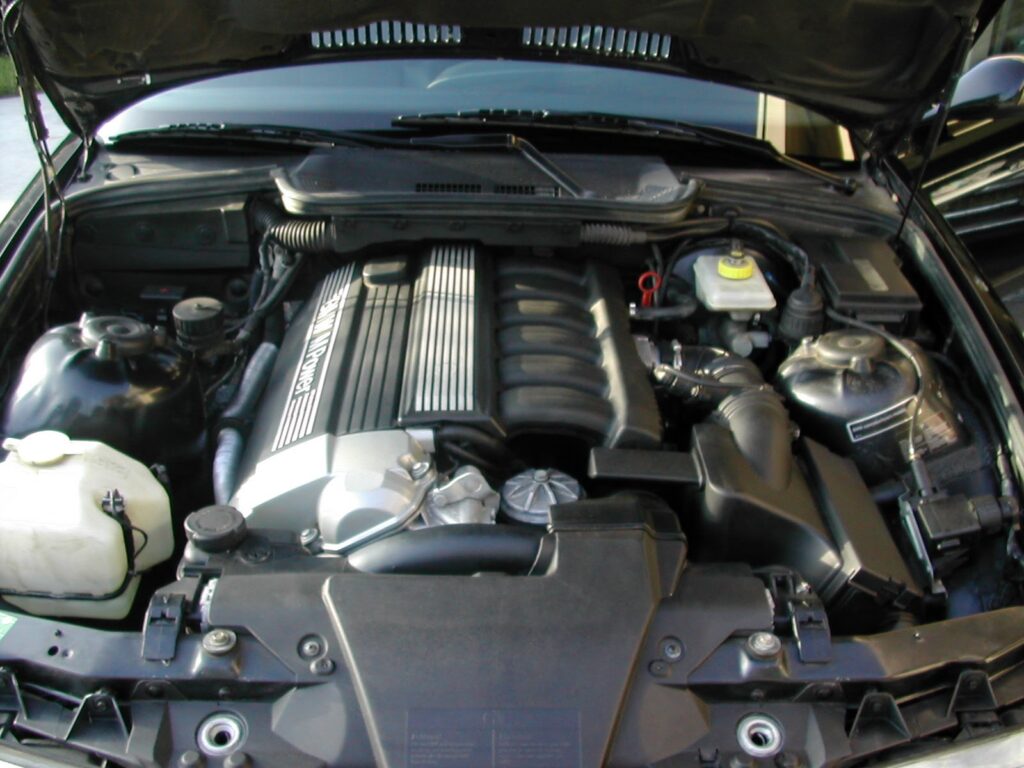 BMW Maintenance Santa Clarita Guide: Essential Care That Protects Your BMW’s Performance and Value 1 BMW M52 inline-six engine bay with performance intake system and brake fluid reservoir - professional automotive maintenance by R2 Motorsports Santa Clarita